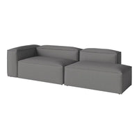 "Modern gray sectional sofa with sleek, solid upholstery and minimalistic design, perfect for contemporary living spaces."