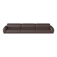 Brown leather sectional sofa with a sleek, modern design and minimalistic smooth texture. Perfect for contemporary interiors.