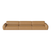 Light brown leather sofa with smooth, minimalist design and rounded edges, perfect for modern interiors.