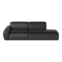 Black leather sectional sofa with a sleek, minimalist design and smooth, matte finish. Perfect for modern interiors.