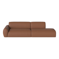 Brown leather sectional sofa with smooth texture and minimalist design, ideal for modern interiors.
