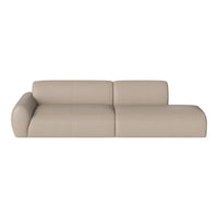 Beige leather sectional sofa with smooth surface and minimalist design, perfect for modern interiors.