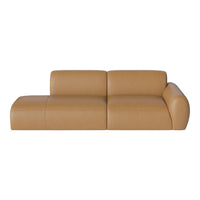 Tan leather sectional sofa with smooth, understated design and minimal seams, perfect for modern interiors.