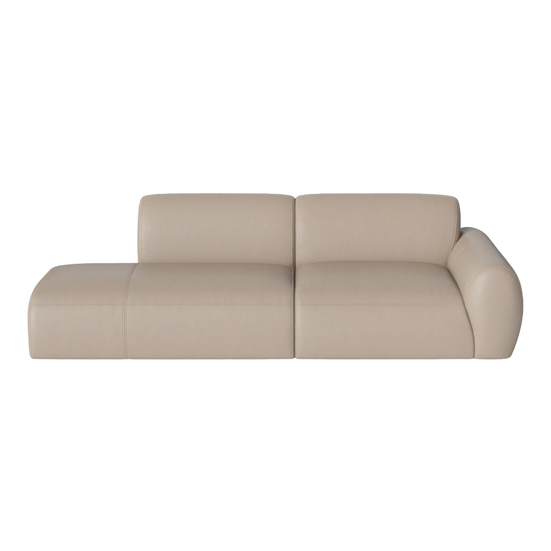 Beige leather sectional sofa with smooth, minimalist design and subtle seam details. Perfect for modern interiors.