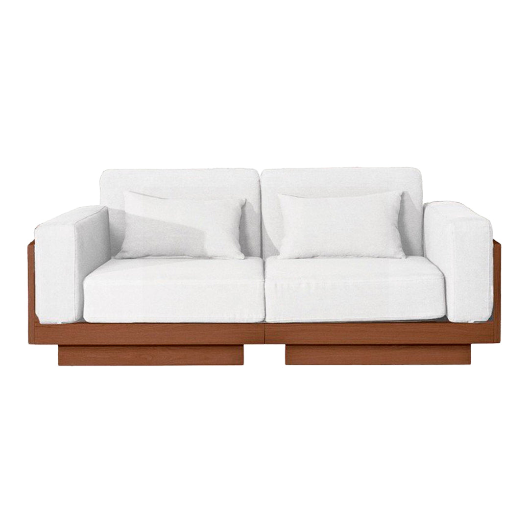 White sofa with plush cushions and a sleek brown wood base, featuring a minimalist design. Perfect for modern decor.
