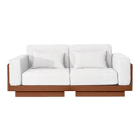 White sofa with plush cushions and a sleek brown wood base, featuring a minimalist design. Perfect for modern decor.