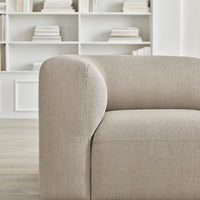 Beige textured sofa with rounded armrests, set against a light, minimalistic background. Perfect for modern interiors.