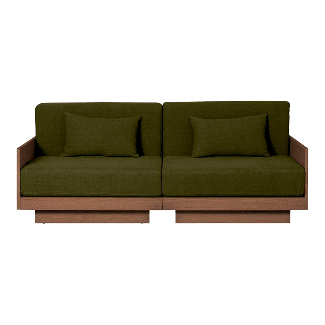 Olive green upholstered sofa with matching cushions and a sleek wooden base, showcasing a modern, minimalist design.