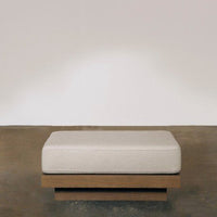Neutral beige cushion on a modern wooden base, featuring a simple, clean design and minimalistic style.