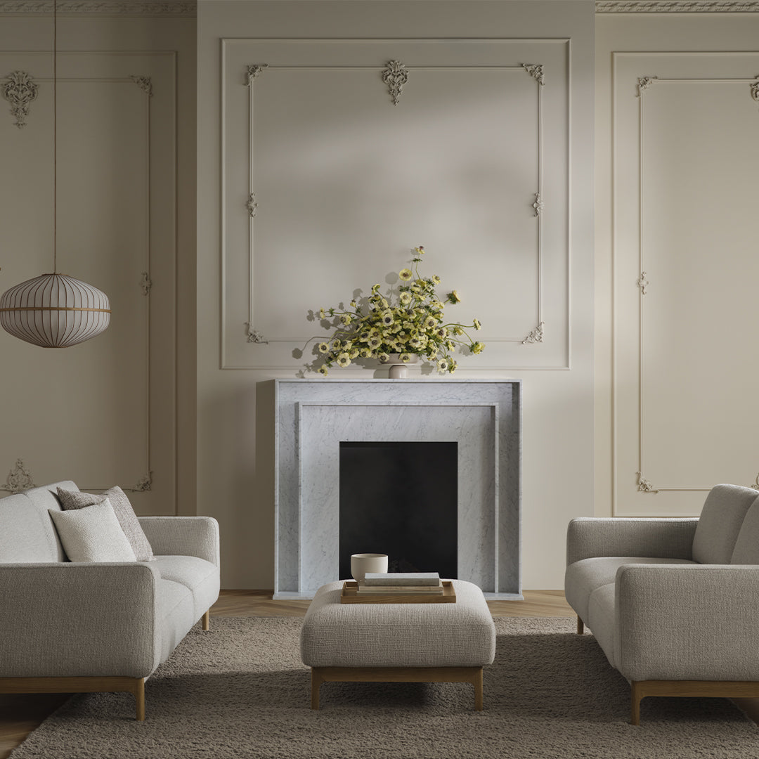 "Modern living room with soft beige sofas, minimalist decor, and subtle textured patterns in neutral tones."