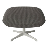 Gray ribbed ottoman with a smooth white base, adding a modern touch to any living space.