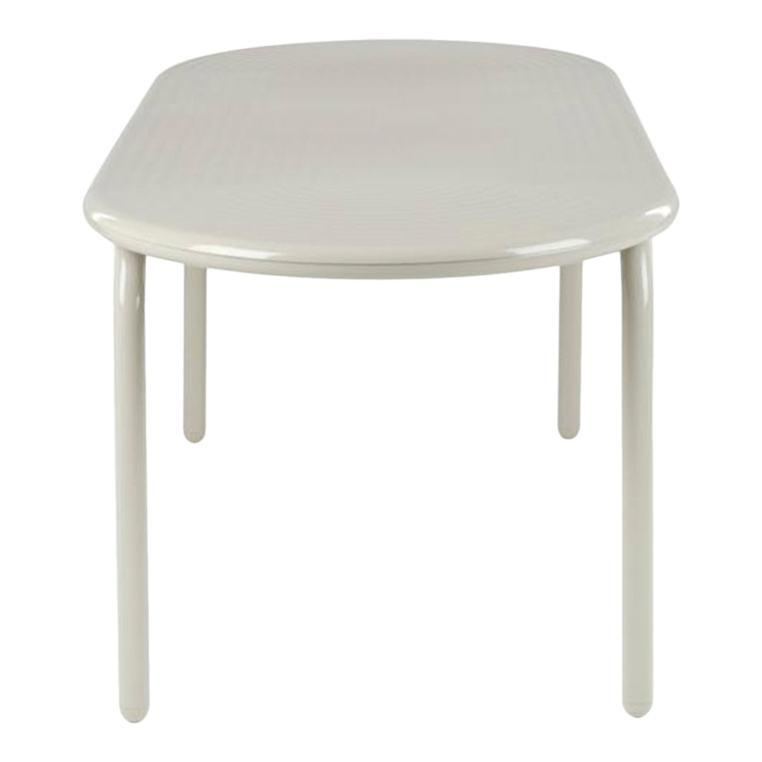Light beige oval table with a smooth, glossy finish and subtly textured surface. Ideal for modern decor.