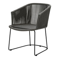 Black woven chair with a minimalist design and sleek metal frame, featuring a modern striped pattern.