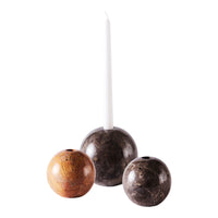 Set of three marble candle holders in rich brown and gray hues, featuring a sleek white candle for elegance.