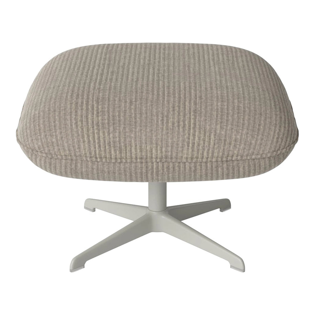 Light grey ribbed ottoman with a smooth texture and white metal base, perfect for modern decor.