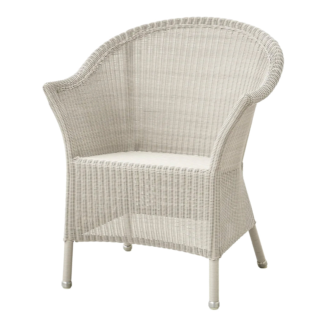 White wicker chair with a rounded shape and textured pattern, ideal for indoor or outdoor spaces.