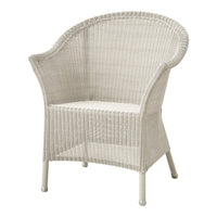 White wicker chair with a rounded shape and textured pattern, ideal for indoor or outdoor spaces.