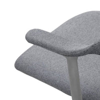 Gray patterned armchair with a textured finish and sleek gray armrest, perfect for modern decor.