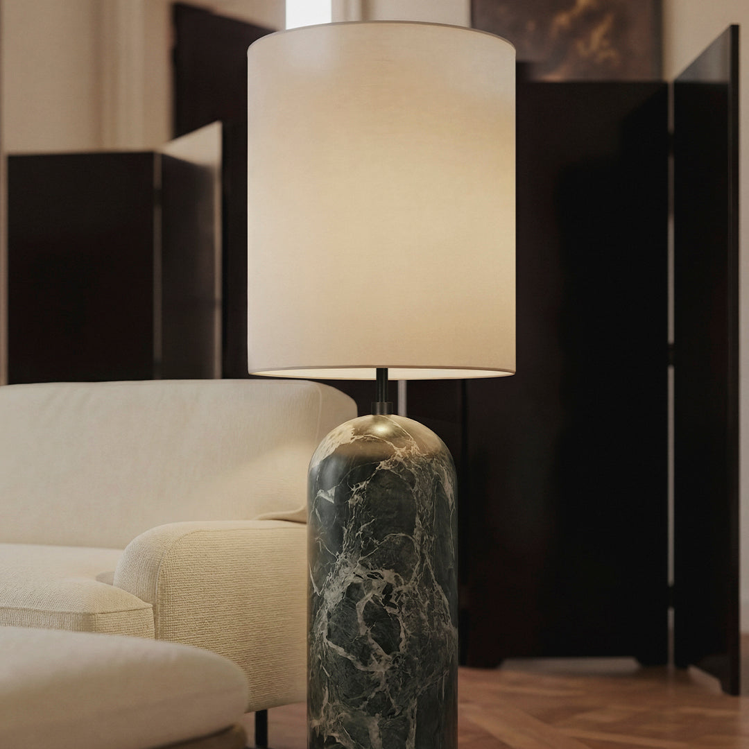 Elegant green marble lamp base with a soft beige shade, creating a sophisticated and modern aesthetic.