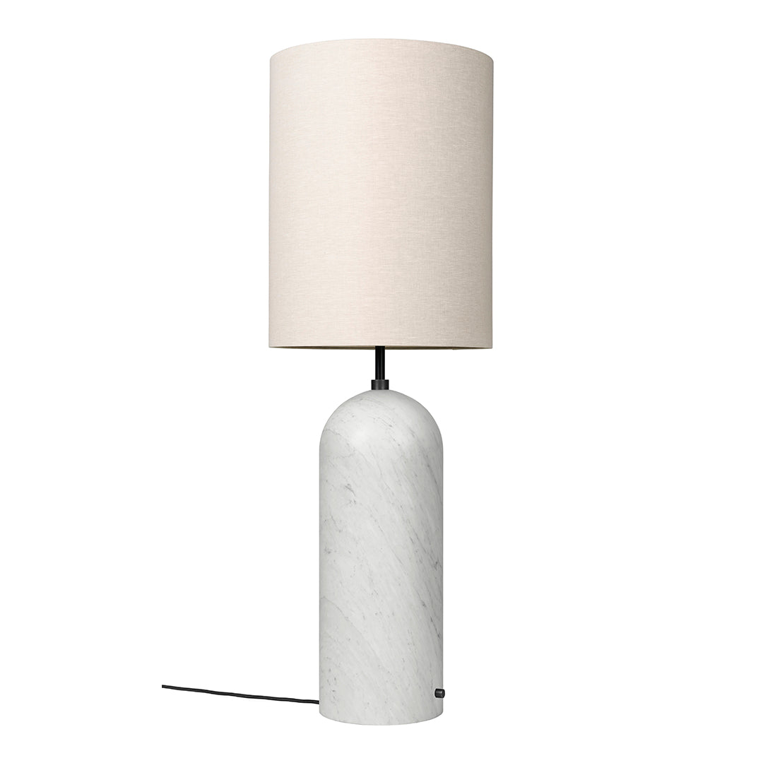 Modern lamp featuring a textured white marble base and a soft beige fabric shade. Clean and minimalistic design.