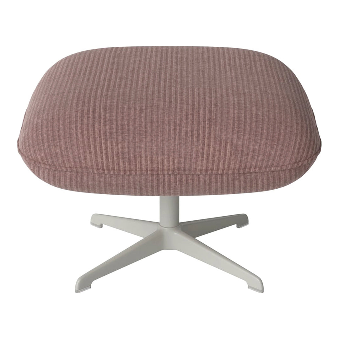 Pink ribbed ottoman with a sleek white base, perfect for modern decor.