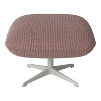 Pink ribbed ottoman with a sleek white base, perfect for modern decor.