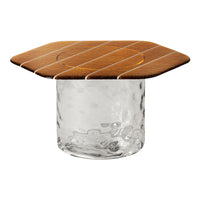 Amber wooden top with white stripes on a clear, textured glass base. Ideal for modern decor.