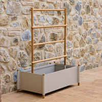 Gray planter box with light wood accents, featuring a minimalist design and a sleek, modern aesthetic.