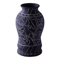 Black vase with white abstract patterns and designs, featuring smooth curves and detailed accents. Perfect for decor.