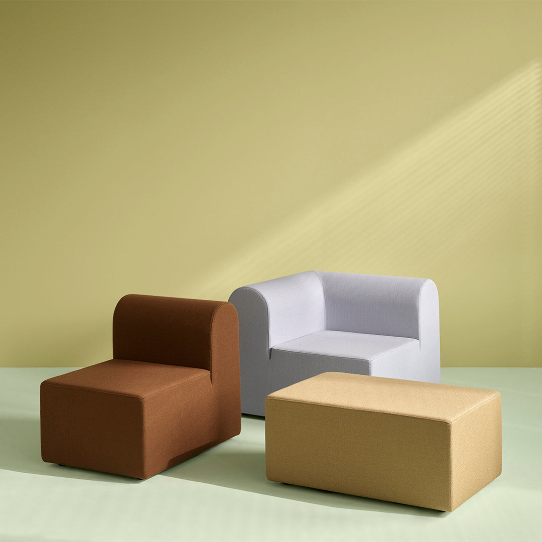Contemporary furniture set featuring brown, light gray, and gold patterns against a soft green and yellow backdrop.