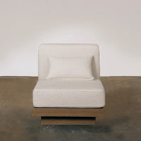 Modern minimalist chair in soft beige upholstery with a sleek wooden base, featuring a smooth, clean design.