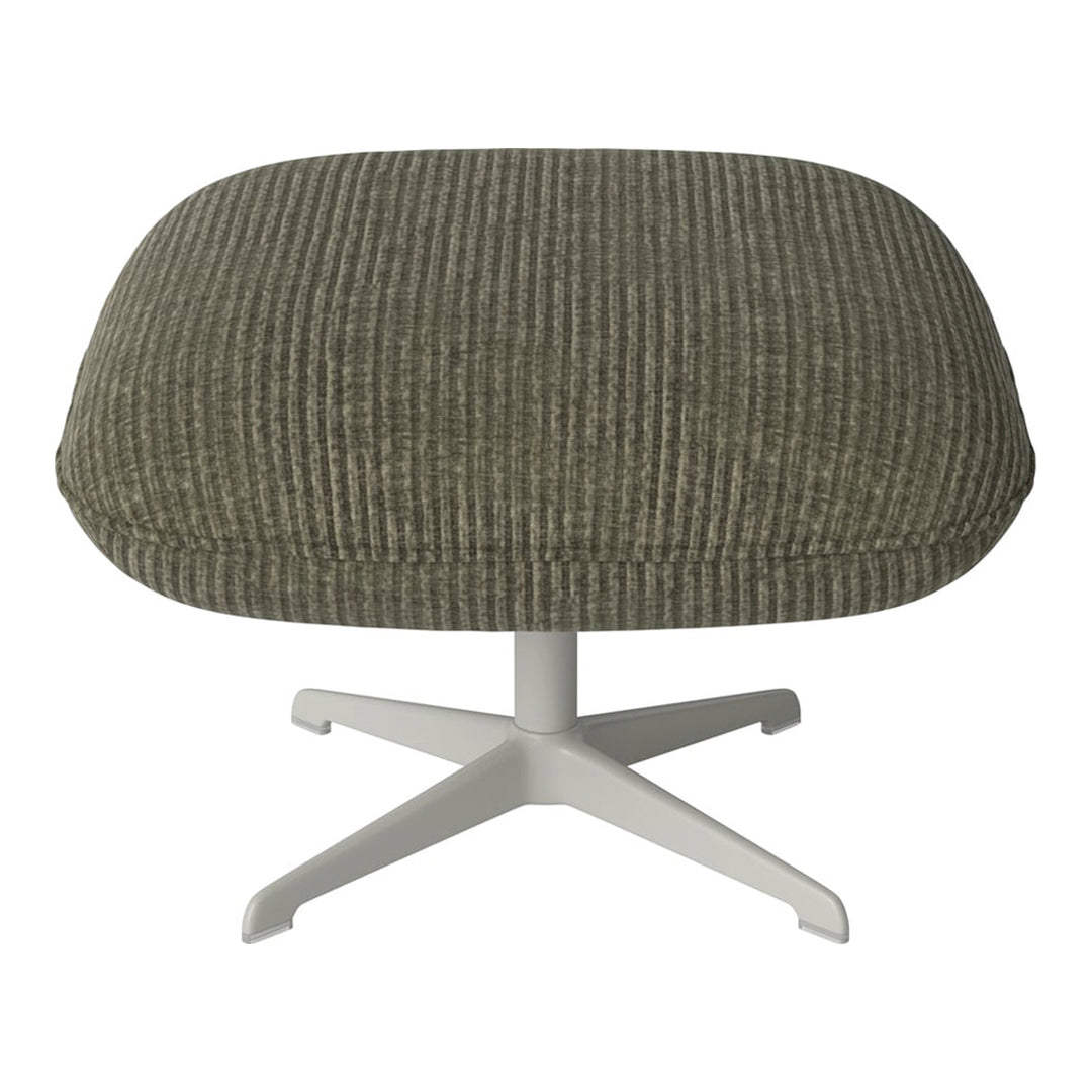 Olive green ribbed fabric ottoman with a white metal base for modern decor.