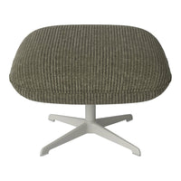 Olive green ribbed fabric ottoman with a white metal base for modern decor.