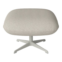 Light beige round ottoman with textured woven pattern on a sleek white pedestal base. 