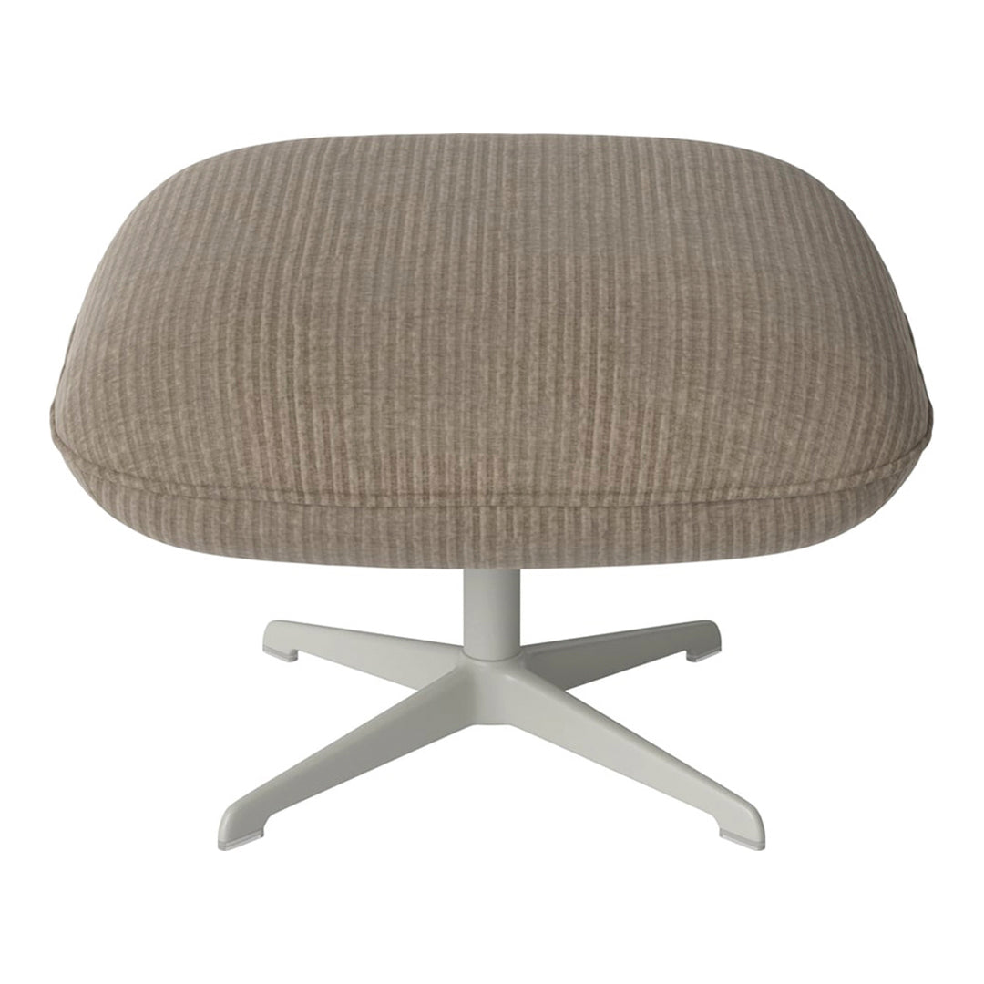 Soft beige ottoman with subtle ribbed texture and a sleek white base. Perfect for modern decor.
