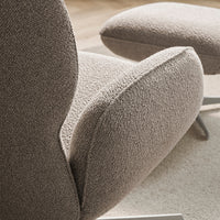 Textured taupe upholstery with plush, rounded shapes enhancing modern design and comfort.