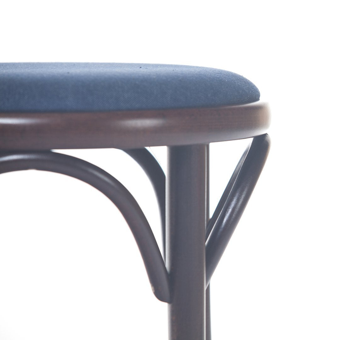 Brown wood frame with a navy blue upholstered seat, featuring a smooth, minimalist design.