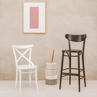 "Stylish black and white bar stools with a minimalistic pattern against a neutral backdrop."
