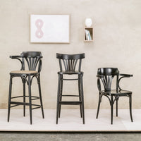 "Set of three stylish black wooden bar stools with sleek curves, perfect for contemporary decor."