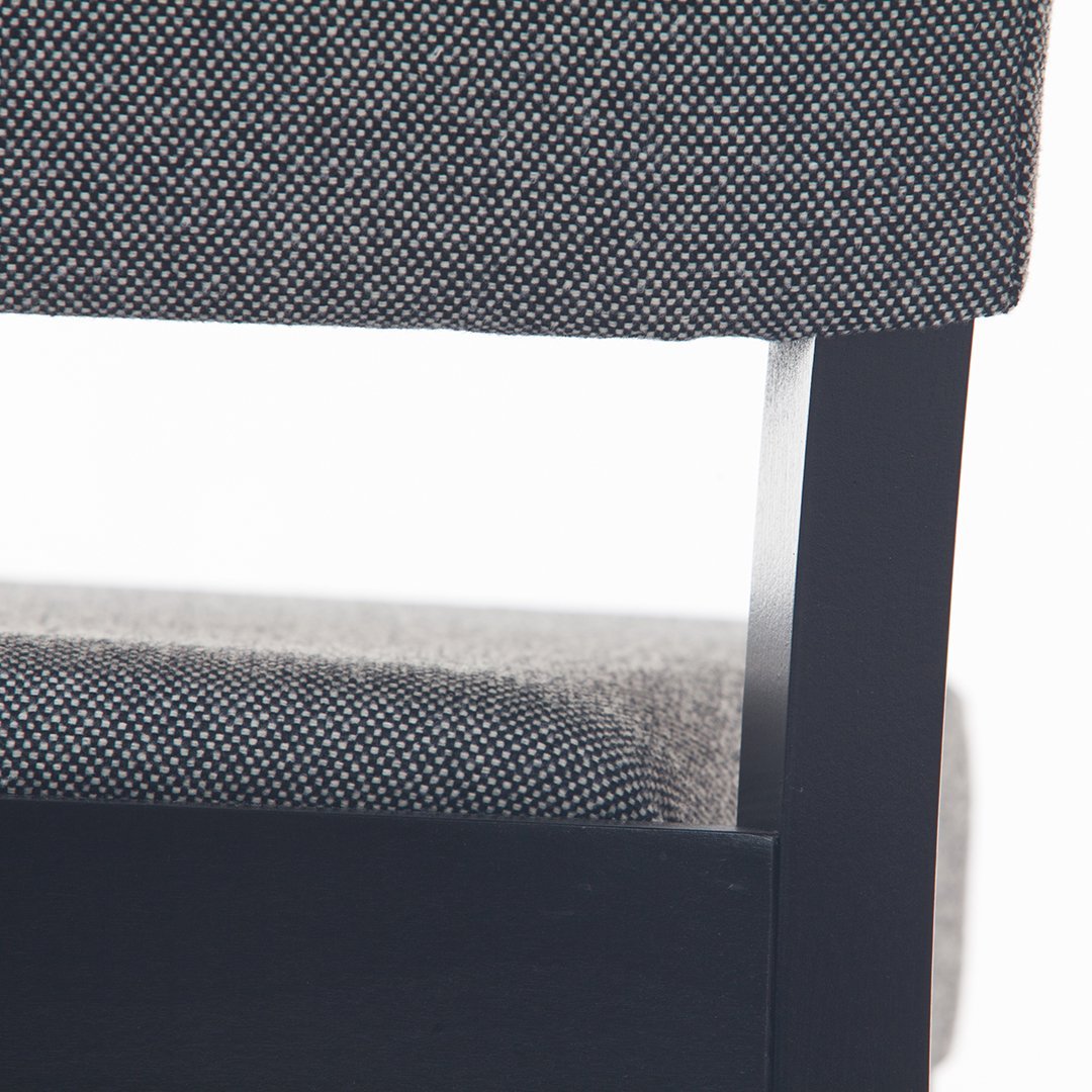 Black and white textured upholstery with a sleek black frame, showcasing modern design and subtle patterns.