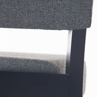 Black and white textured upholstery with a sleek black frame, showcasing modern design and subtle patterns.
