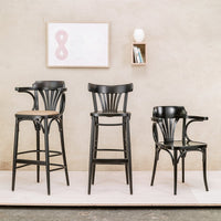 "Set of three sleek black wooden bar stools with elegant curved backs and minimalist design against a neutral background."