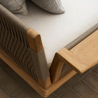 Beige cushion with textured gray fabric, natural wood accents, and woven pattern on the side. Elegant modern design.