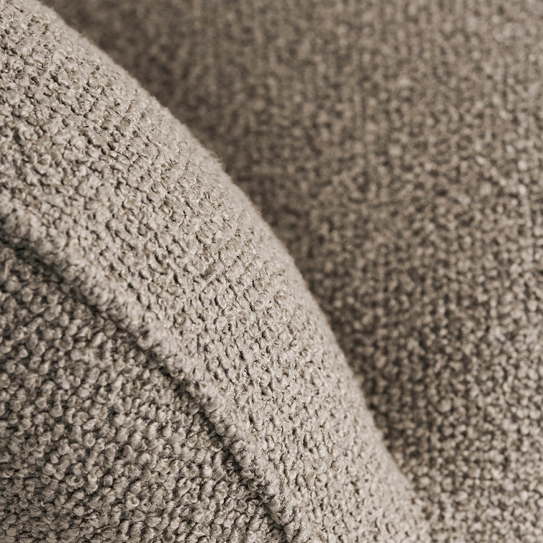 Cozy taupe textured fabric showcasing a subtle, woven pattern for an inviting, stylish look.