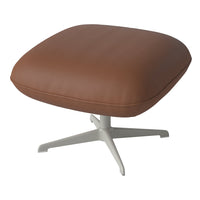 Brown faux leather cushion on a sleek white base, featuring a modern and minimalist design.
