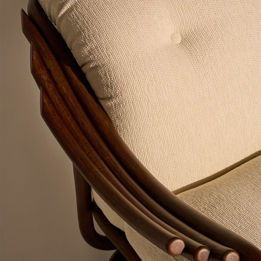 Beige textured upholstery with a rich brown wooden frame, featuring a subtle button detail.