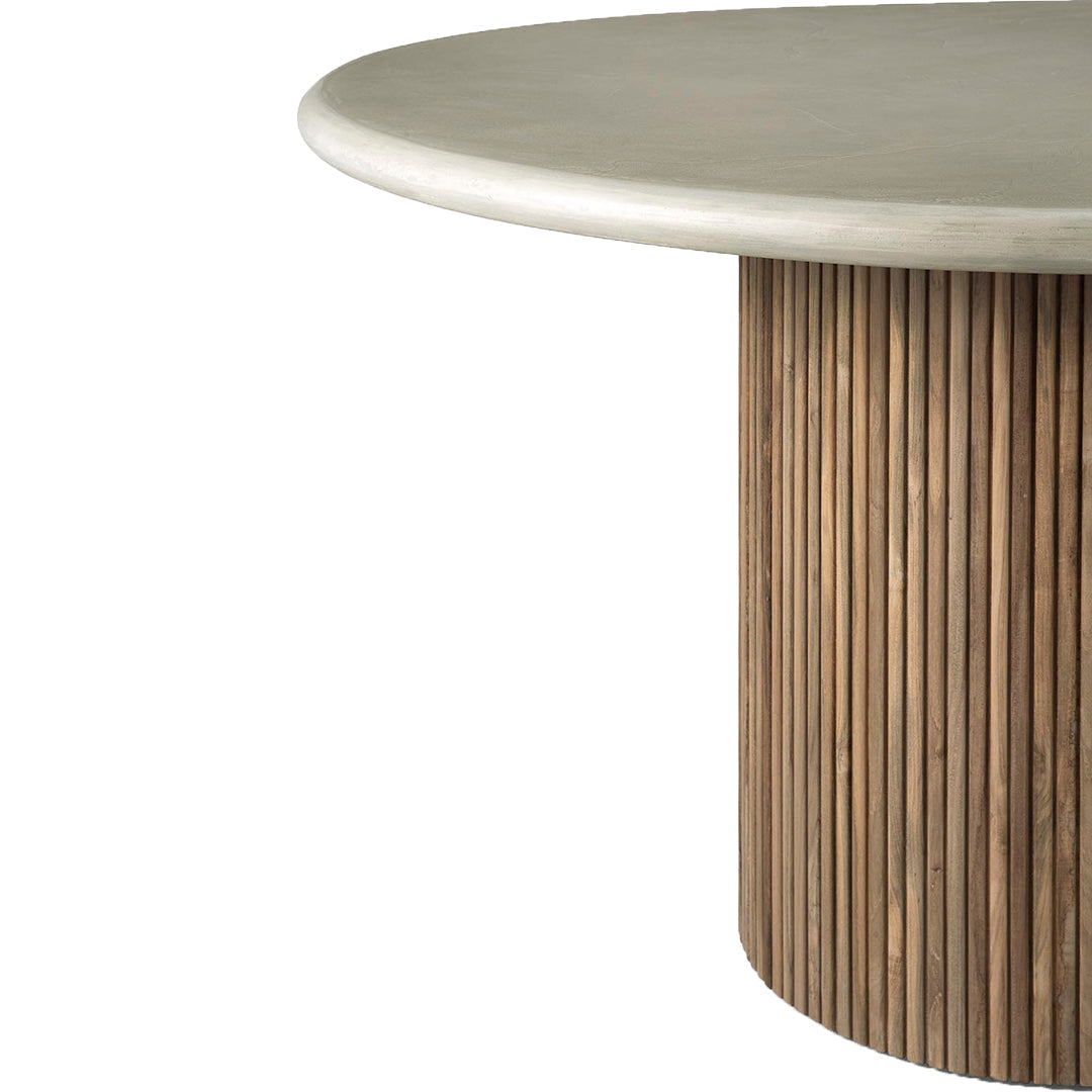 Round concrete tabletop with a natural wood ribbed base; neutral tones and textured patterns create a modern aesthetic.