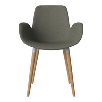 Green textured chair with light wooden legs, featuring a modern design and natural color palette.