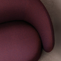 Textured upholstery in deep burgundy and subtle purple, showcasing a modern, stylish pattern.