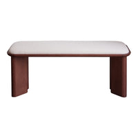 Brown wooden bench with a light beige, textured upholstered cushion on top, featuring a minimalist design.